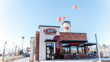 raising cane’s restaurant with inflatable mascot