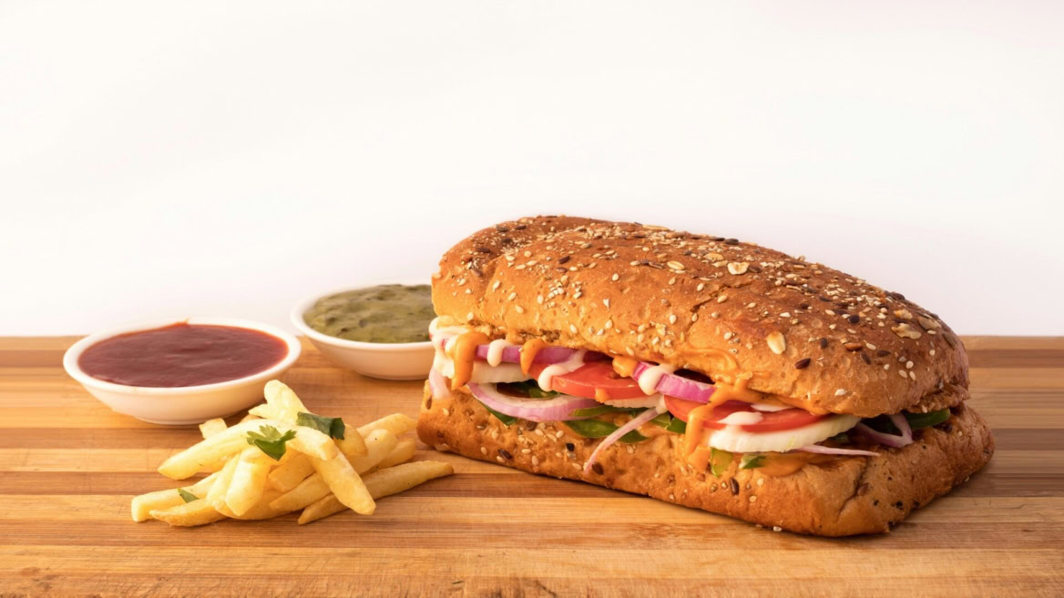 seeded sandwich, fries and dipping sauces