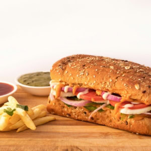 seeded sandwich, fries and dipping sauces