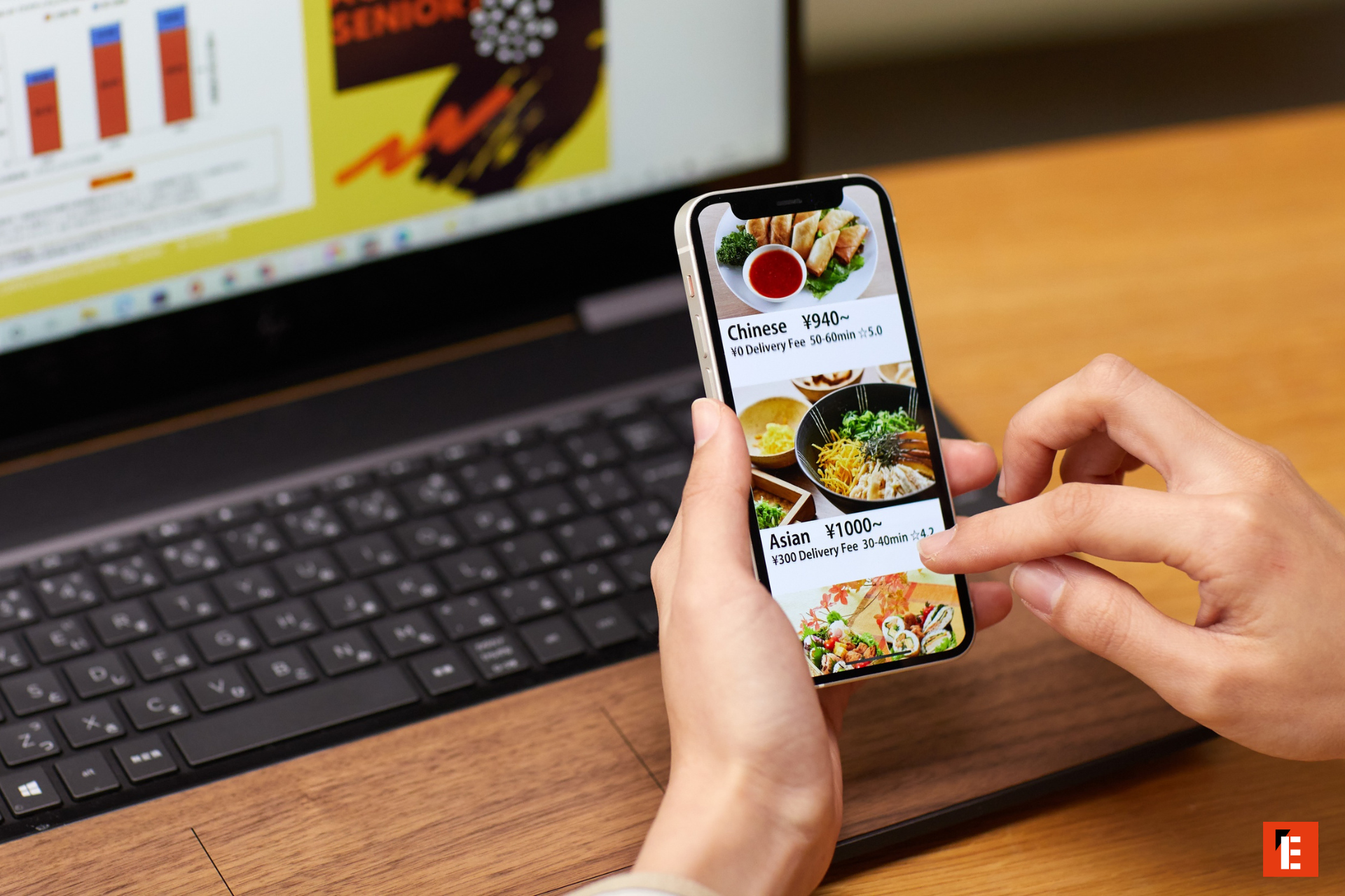 food delivery app on laptop desk