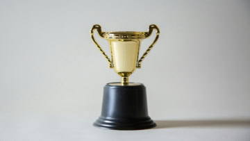 trophée doré sur fond gris Élégant