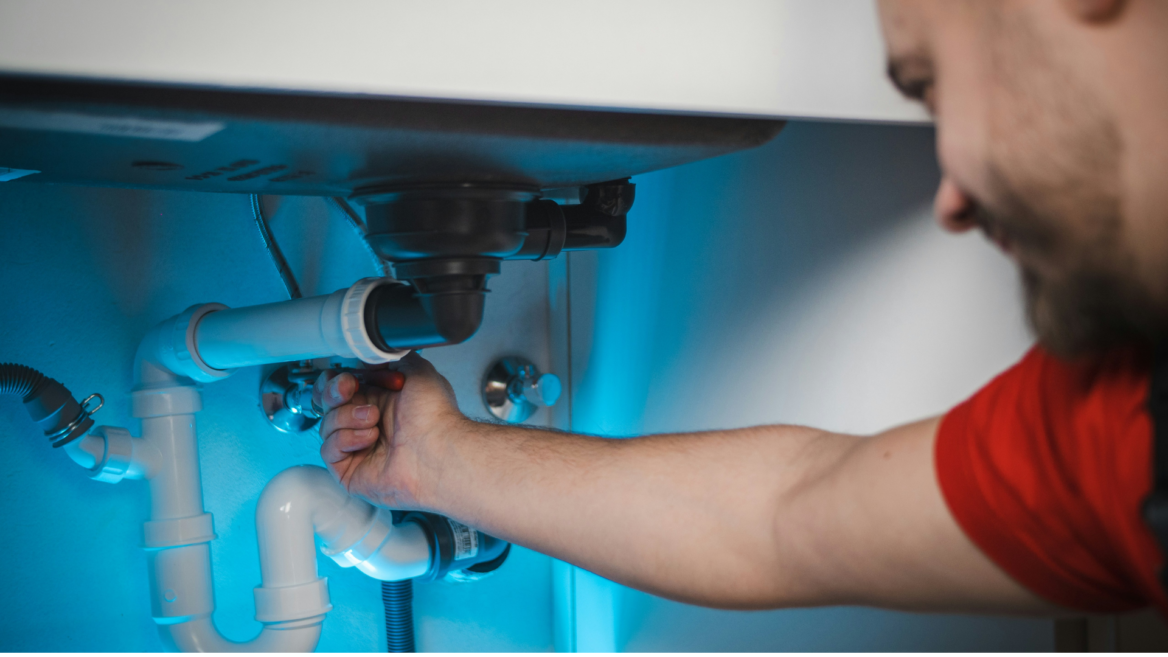 under sink plumbing repair in progress