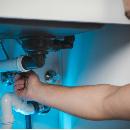 under sink plumbing repair in progress