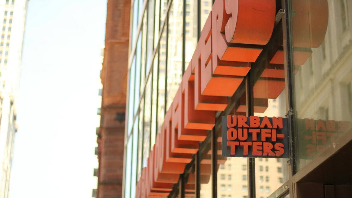 urban outfitters storefront with orange city signage