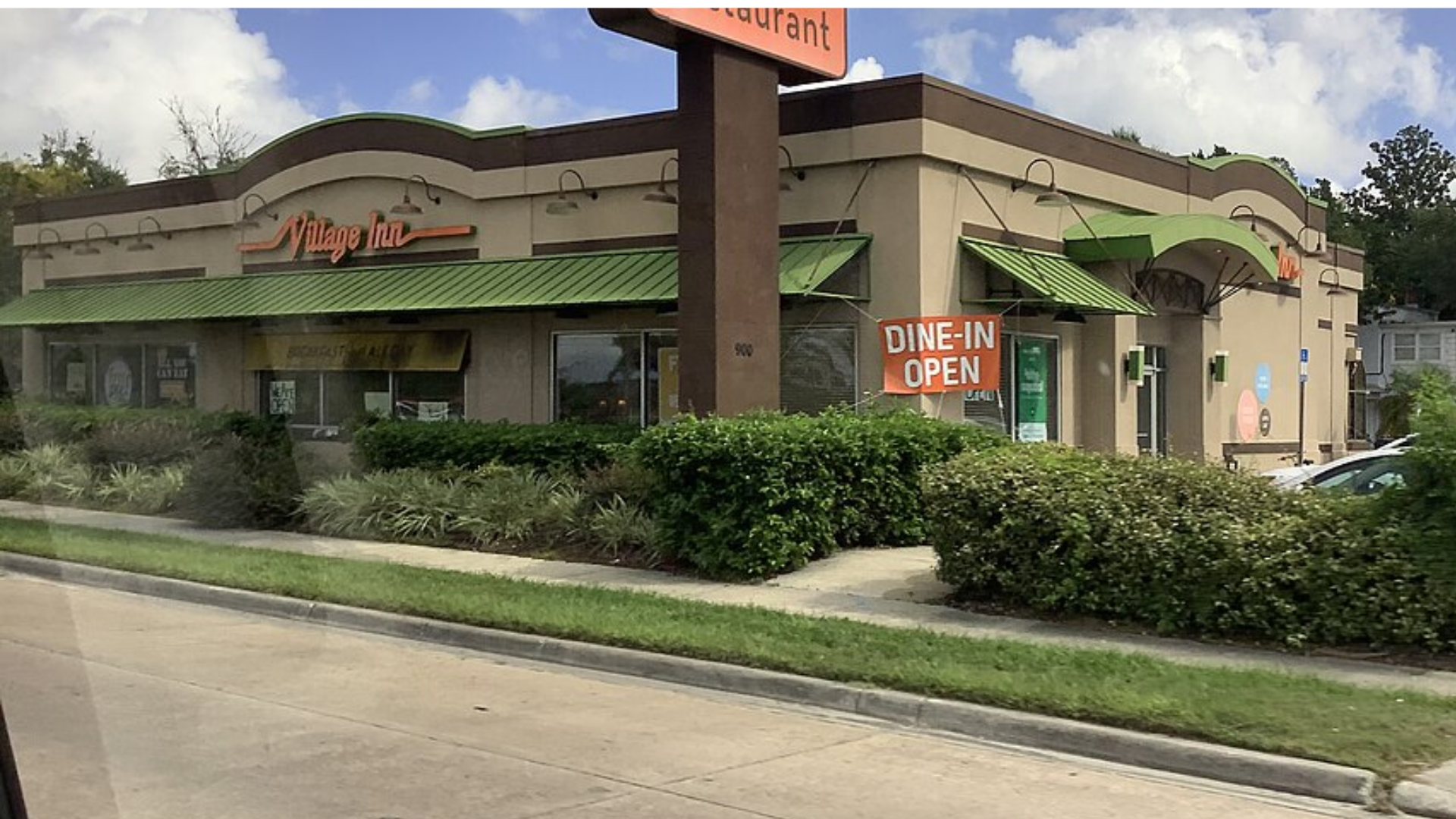 village inn restaurant exterior with green awning