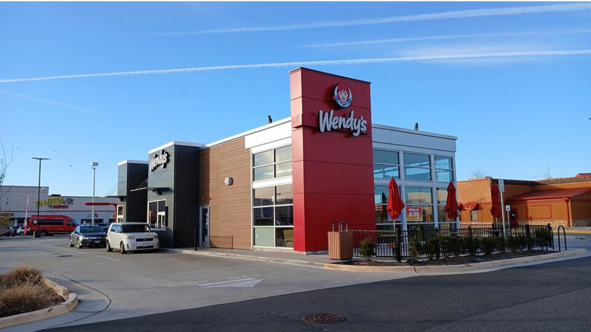 modern wendys restaurant with patio and parking lot