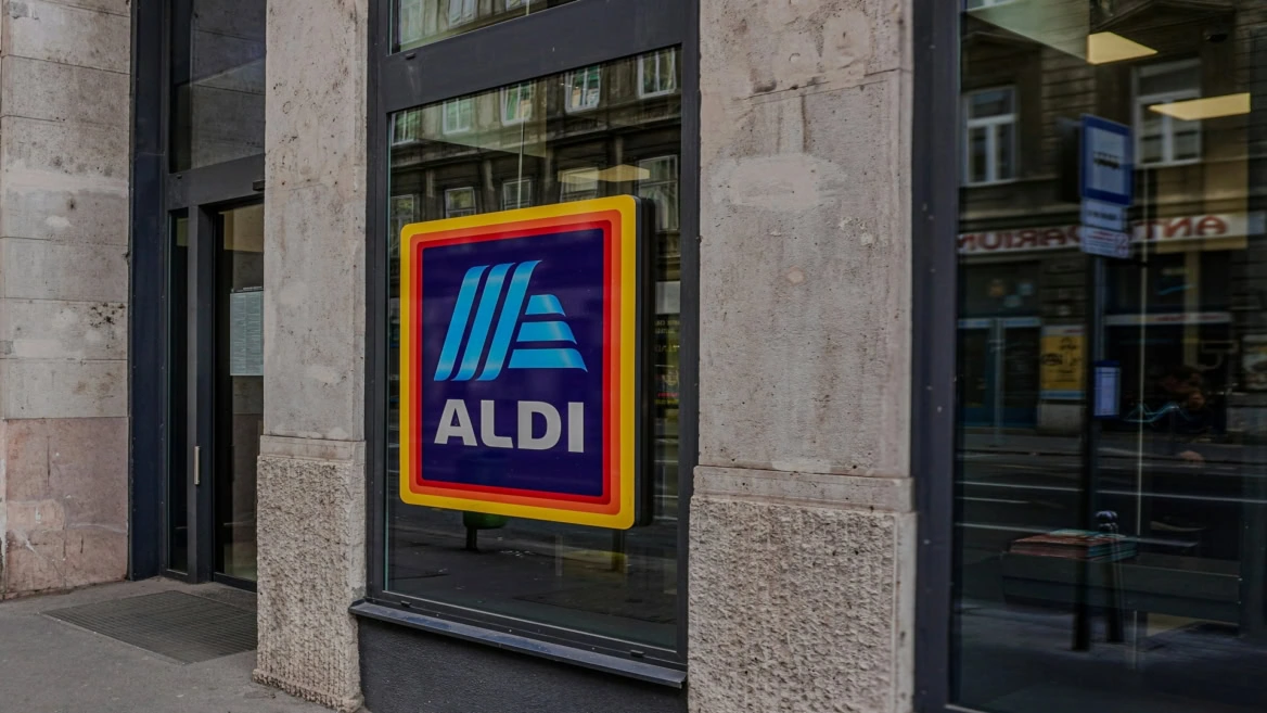 aldi storefront window sign in city street