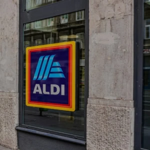 aldi storefront window sign in city street