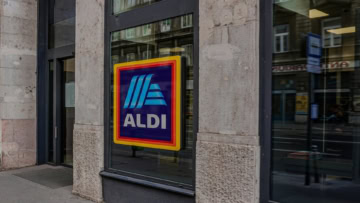 aldi storefront window sign in city street