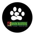 bark busters dog training logo with paw print
