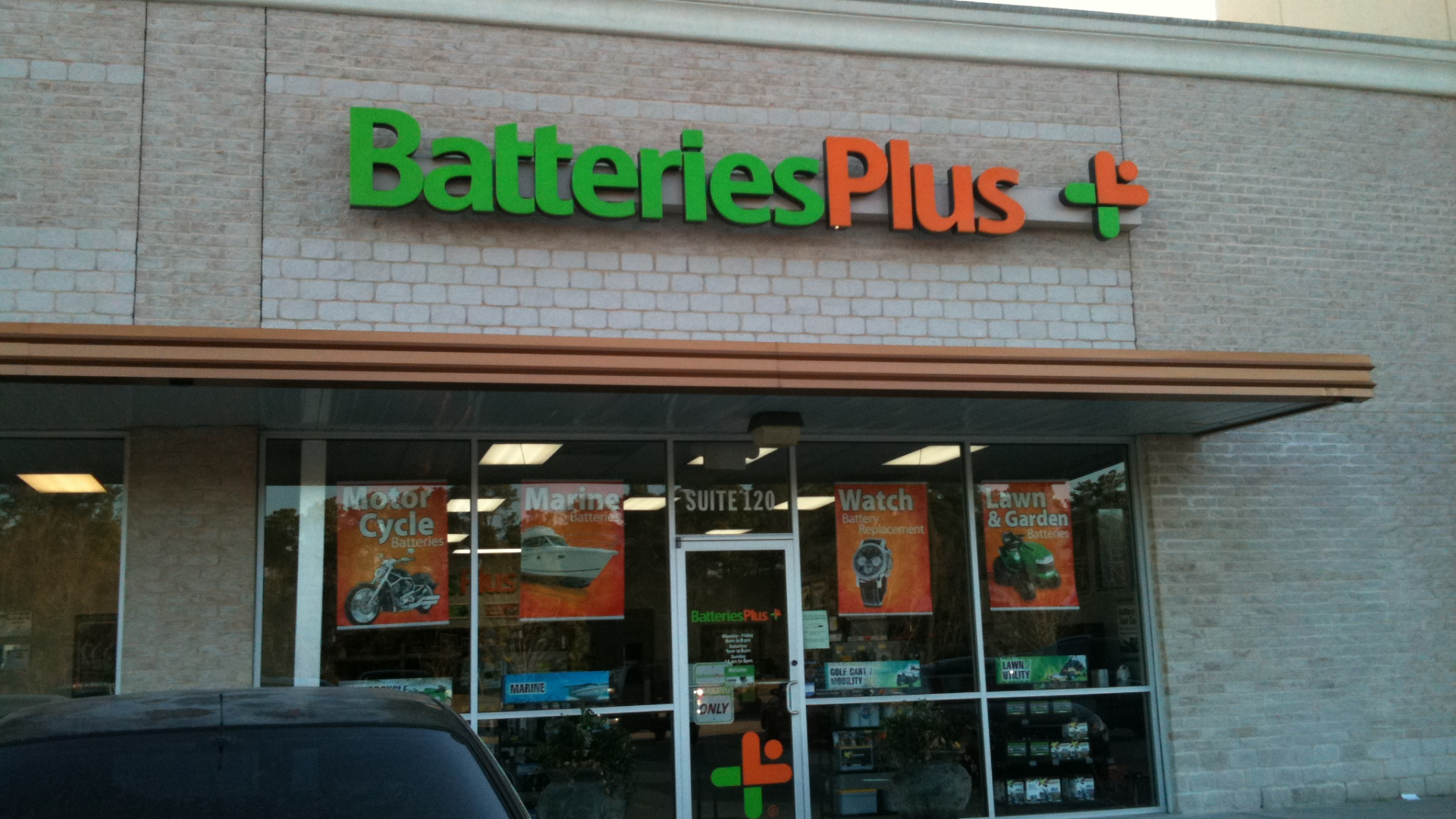 batteries plus storefront with service signage