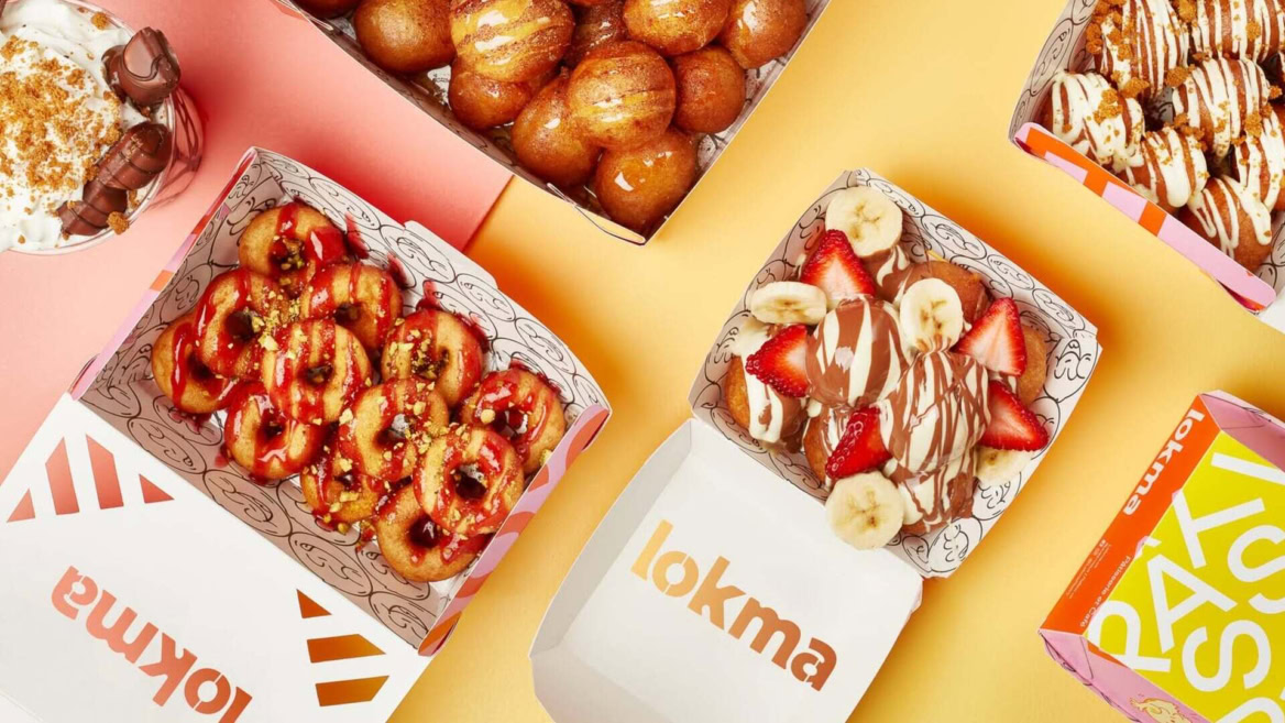 boîtes de donuts gourmands sur fond pastel