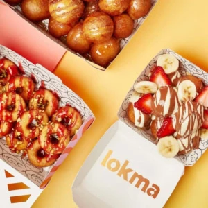 boîtes de donuts gourmands sur fond pastel