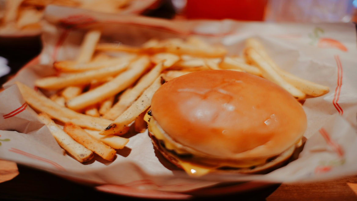 cheeseburger and fries in basket