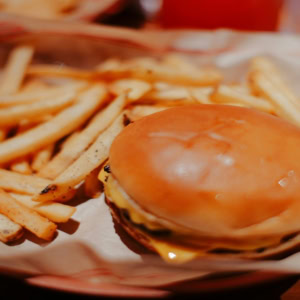 cheeseburger and fries in basket
