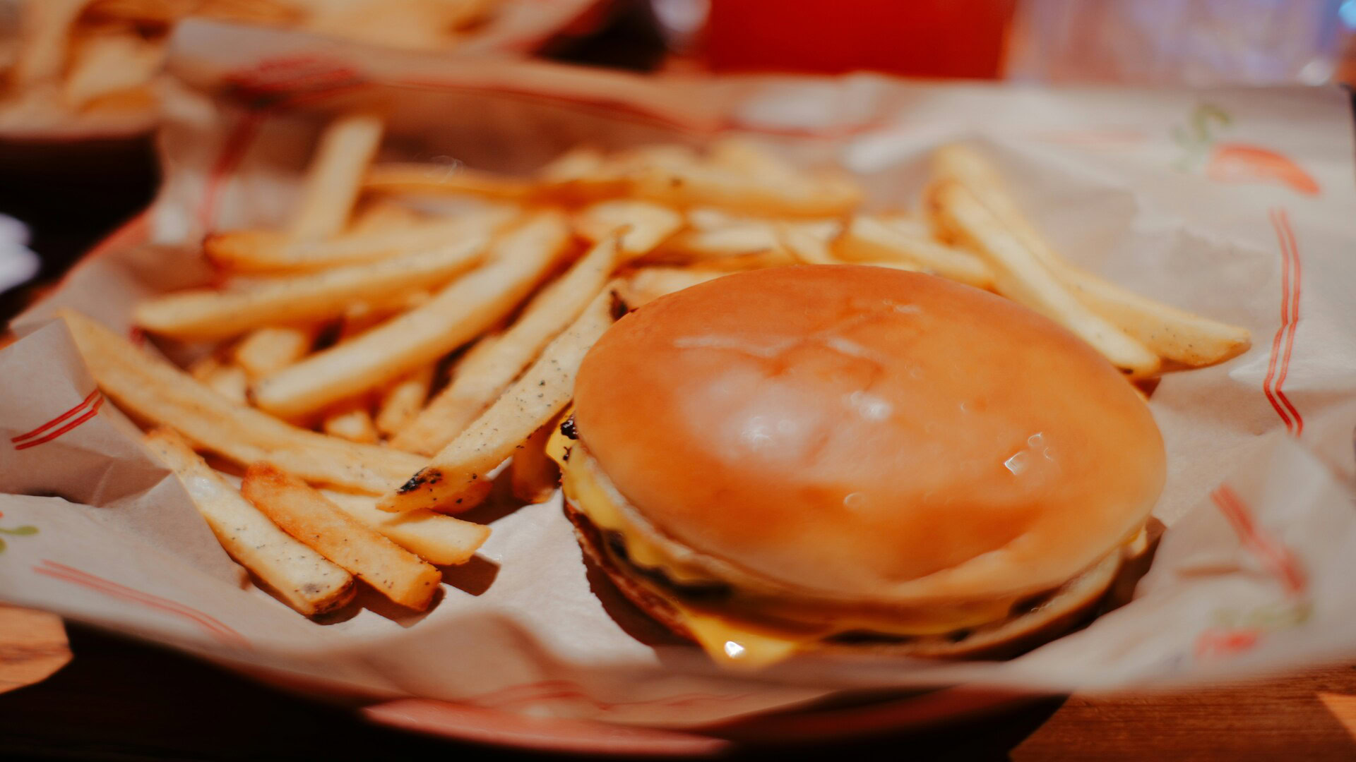 cheeseburger and fries in basket