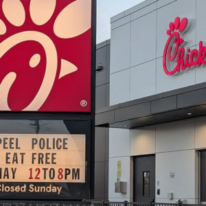 chick fil a sign: peel police eat free event