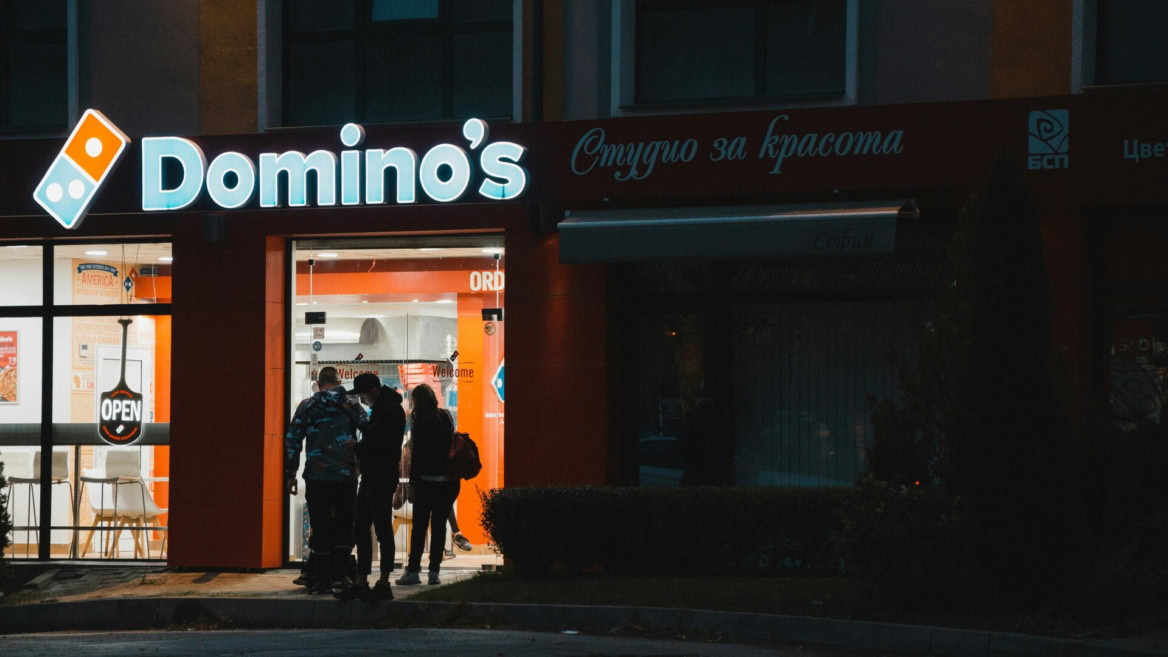 domino’s pizza storefront at night with customers