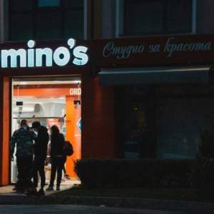 domino’s pizza storefront at night with customers