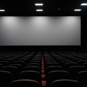 empty modern cinema auditorium with blank screen