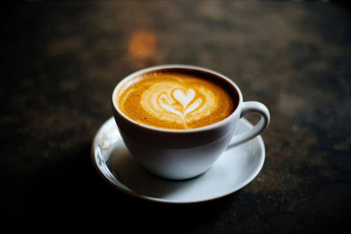 elegant espresso cup with heart latte art