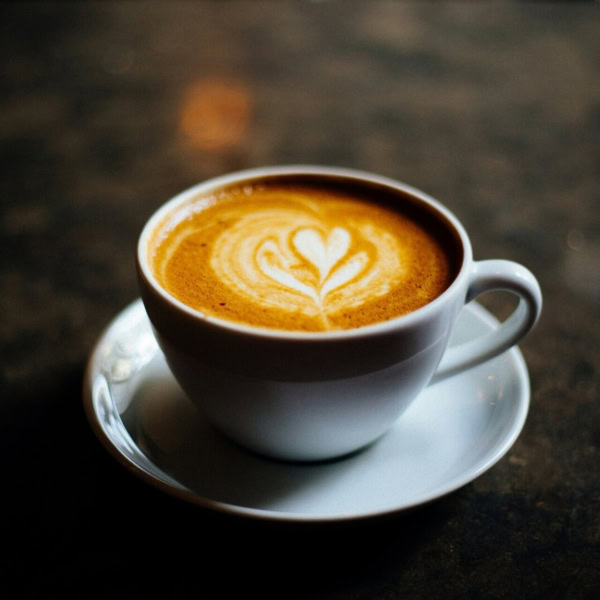 elegant espresso cup with heart latte art