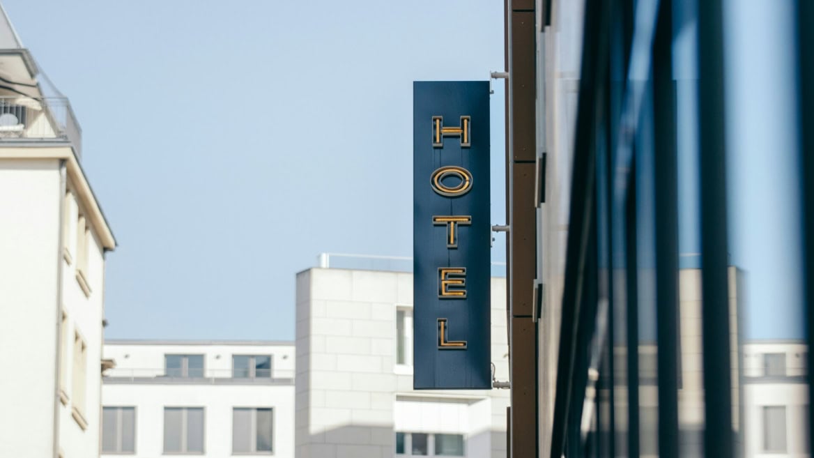 modern hotel sign on urban street