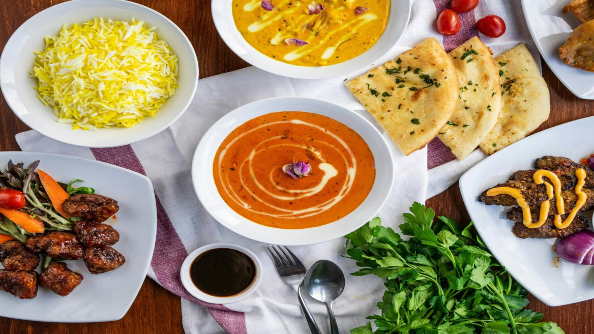 indian feast with curry, rice and naan