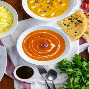 indian feast with curry, rice and naan