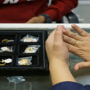 gold ring fitting at jewellery counter