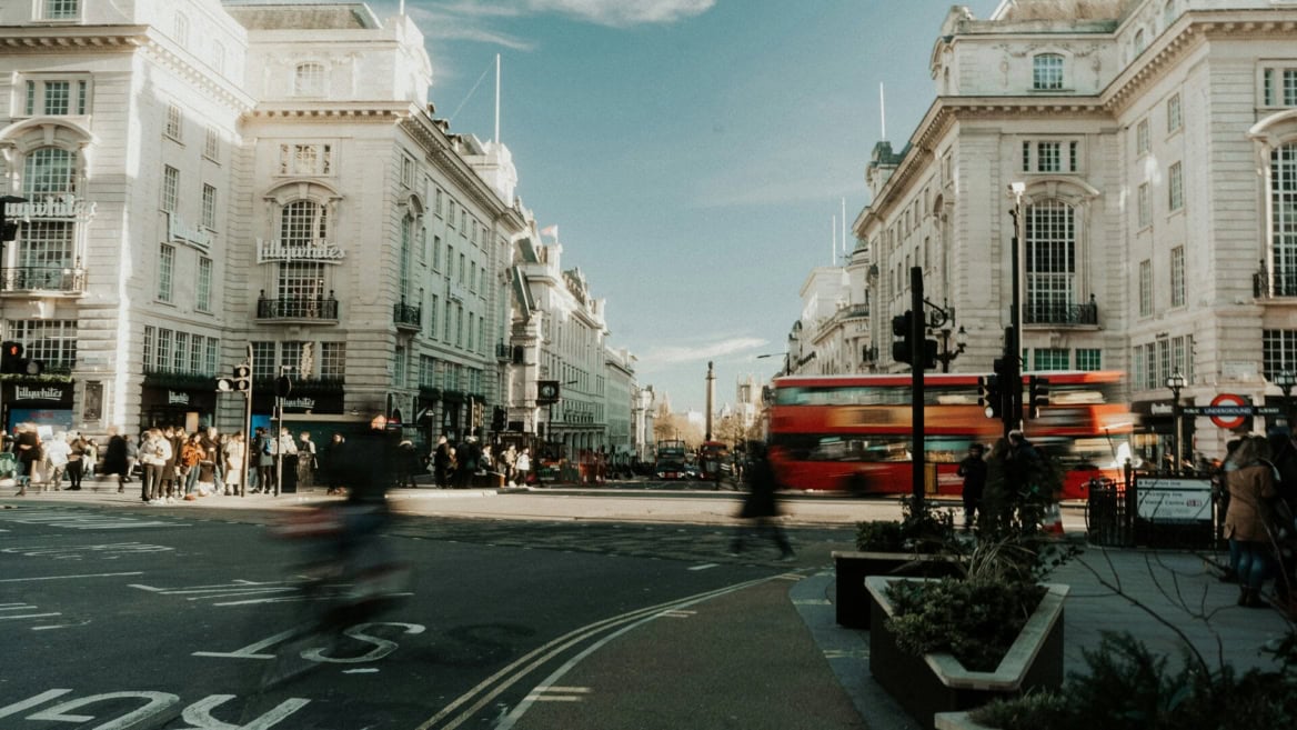 london street with red double decker bus