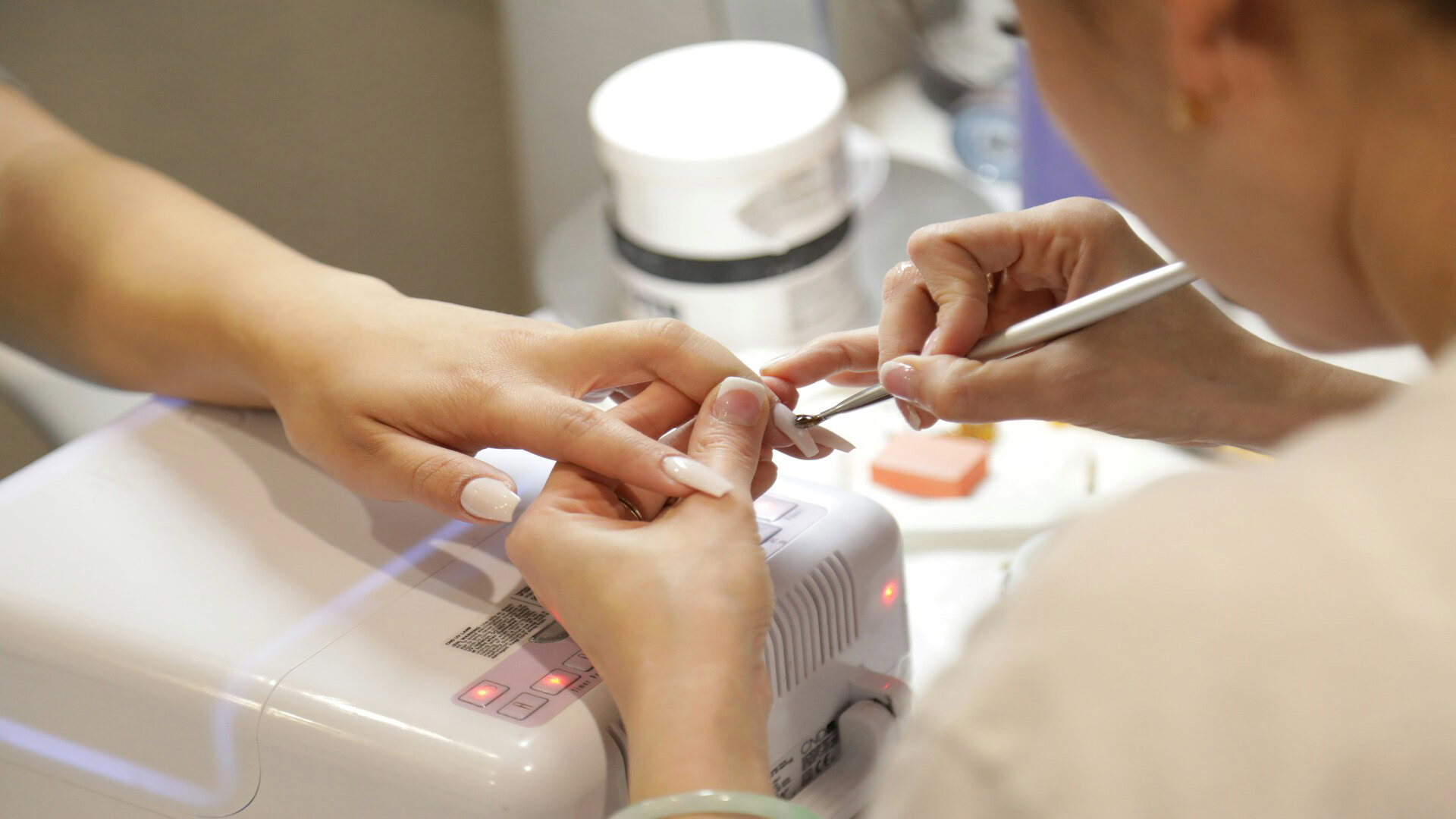 manicure close up: white nails in progress