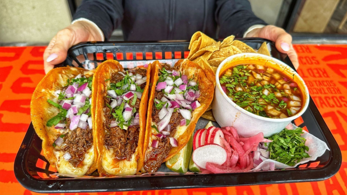 mexican taco tray with consommé and lime