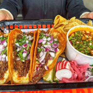 mexican taco tray with consommé and lime