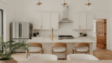 bright modern kitchen with marble island