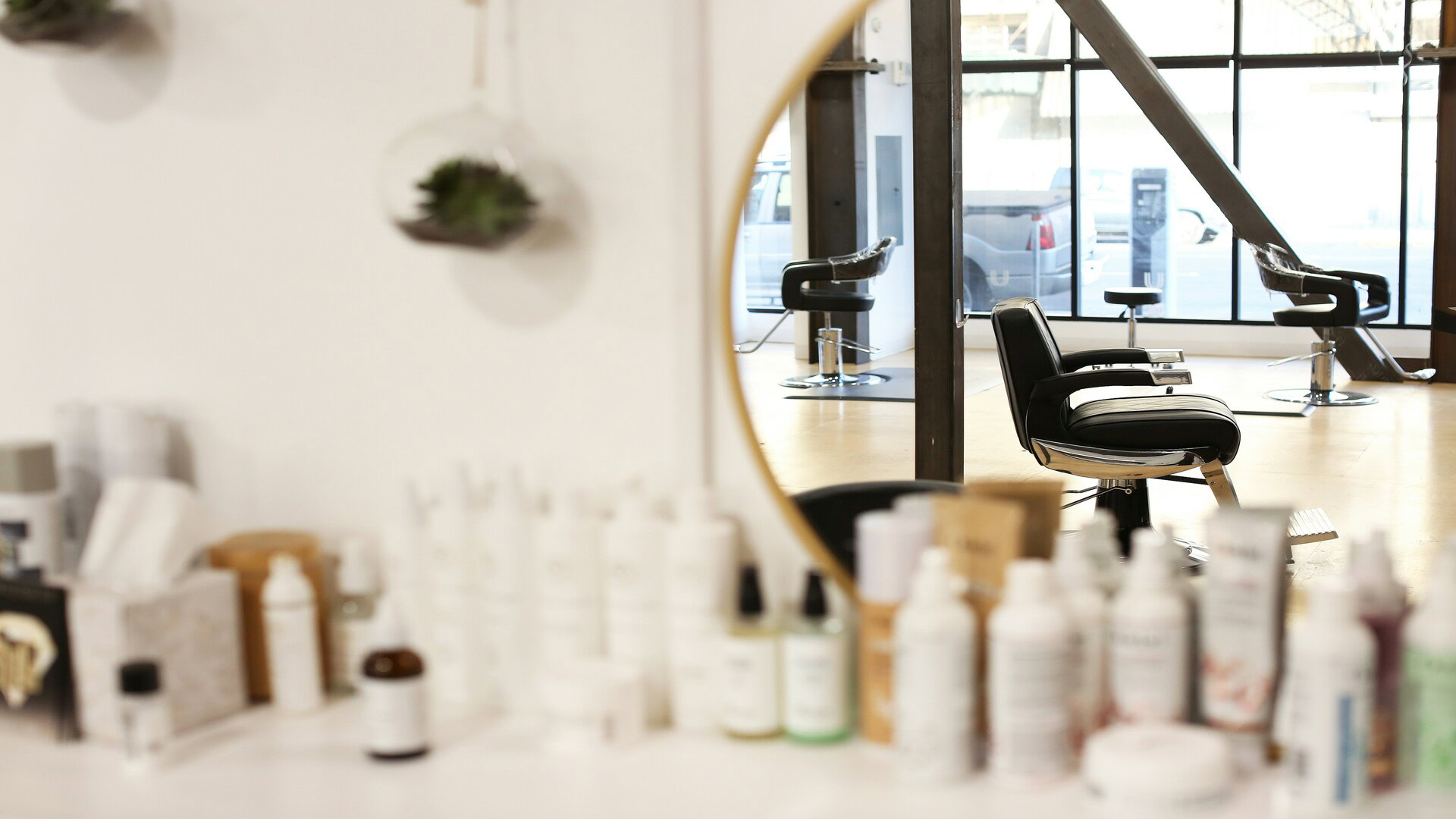 modern hair salon interior with mirrors and chairs