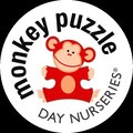 monkey puzzle day nurseries logo with red monkey mascot