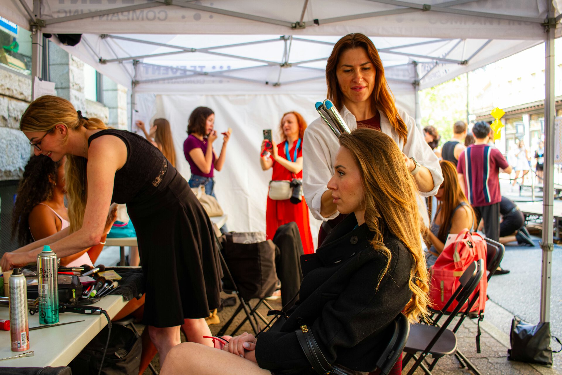 outdoor beauty tent hair styling session