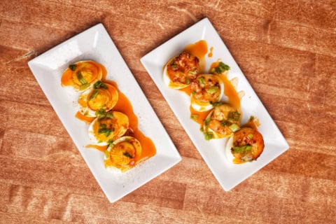 overhead gourmet appetizers on white plates