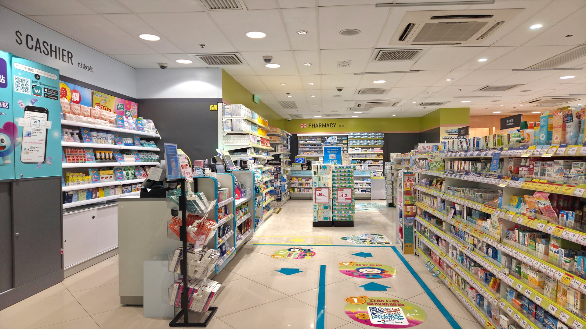 bright pharmacy aisle with cashier and shelves