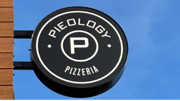 pieology pizzeria sign under clear blue sky