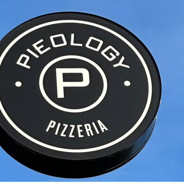 pieology pizzeria sign under clear blue sky