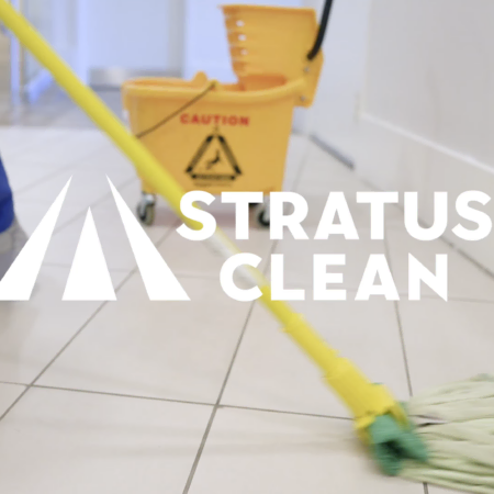 professional floor cleaning with caution bucket