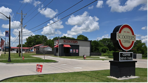 scooter’s coffee drive thru under blue sky