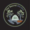 secret garden circular logo with greenhouse and flowers
