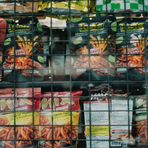 colorful snacks behind wire grid display