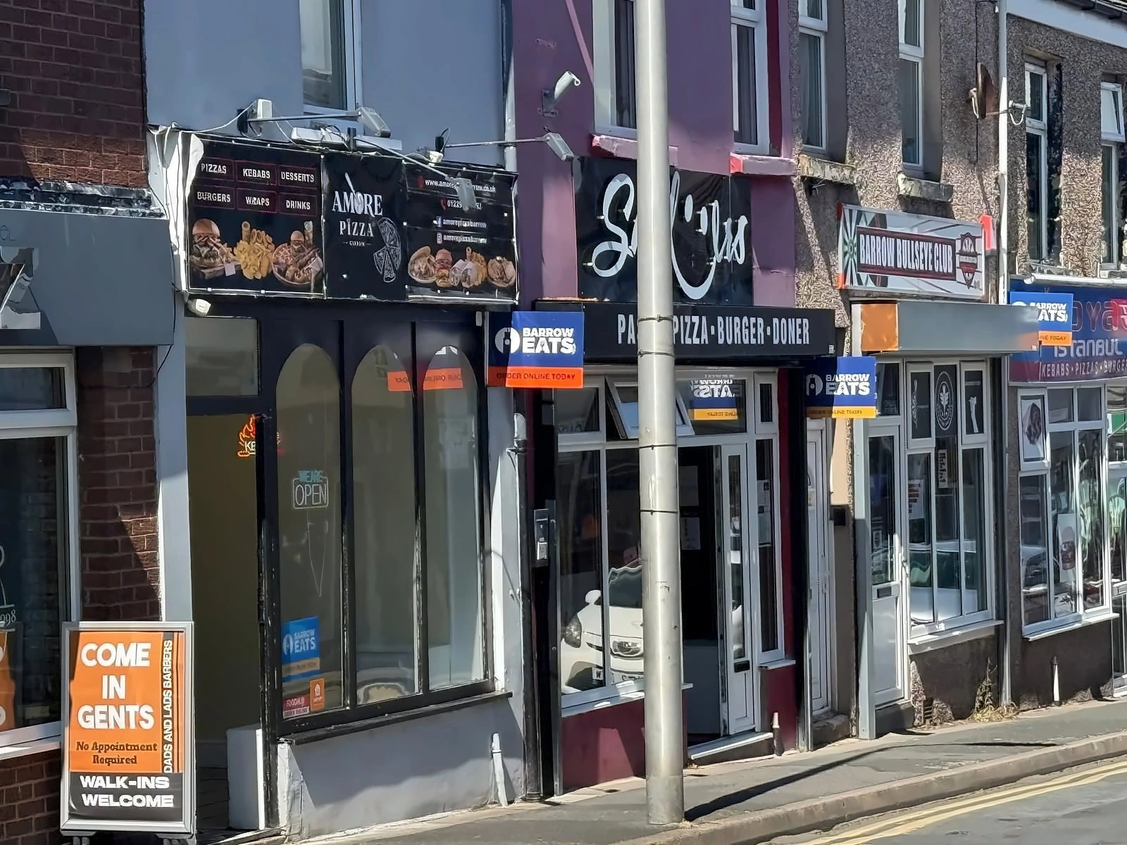 amore pizza and barber shop high street frontage