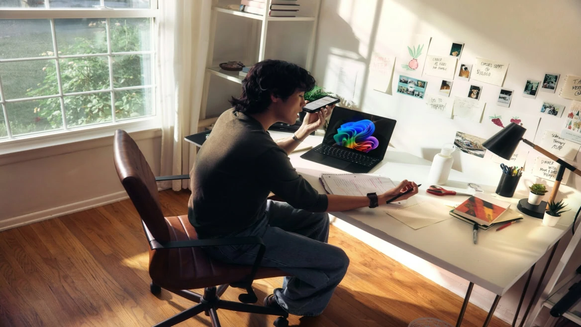 sunny study desk with laptop and notes
