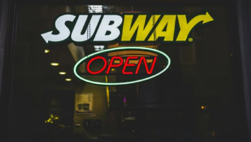 subway open sign in night window