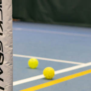 indoor tennis court net and balls